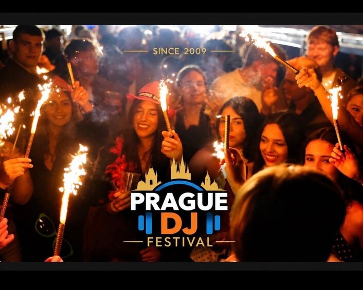 A group of people holding sparklers at the Prague DJ Festival. 3