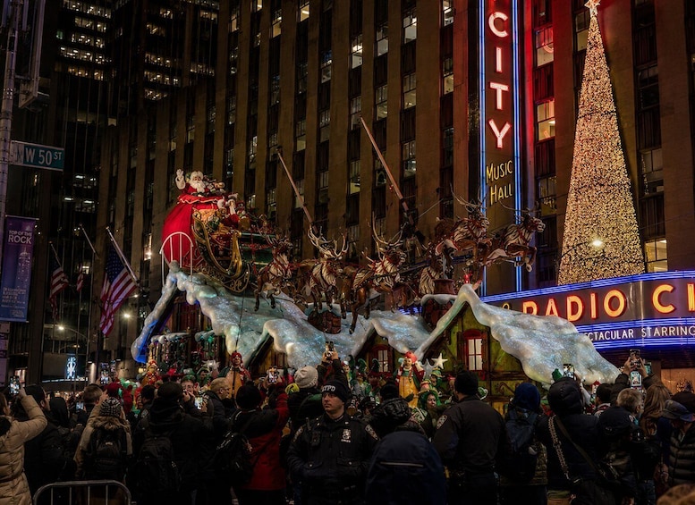 A festive parade with a Santa Claus float, a Radio City Music Hall backdrop, and a crowd of spectators. 4