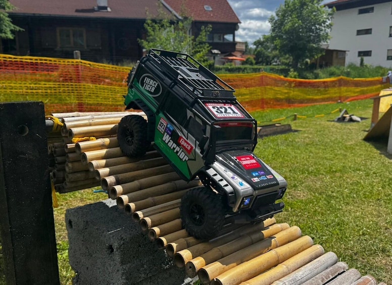 A toy car on a wooden ramp. 3