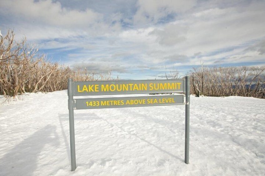 A sign indicating the Lake Mountain Summit is 1433 metres above sea level. 5