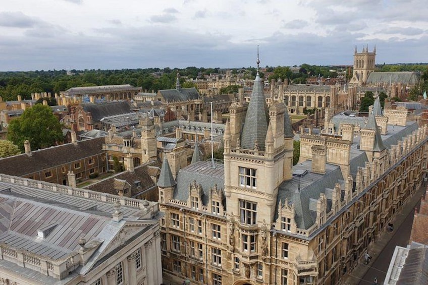 A historic building complex with multiple towers and spires, surrounded by other buildings. 4