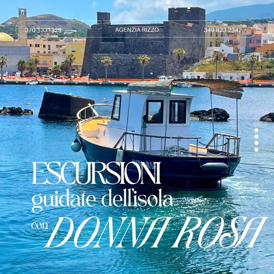 A boat on water with a coastal town in the background. 5