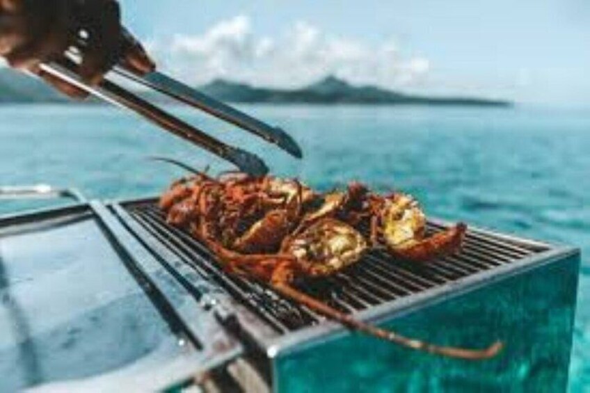 Grilled seafood on a grill by the water. 2