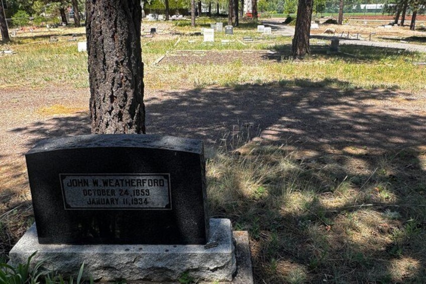 A gravestone with the name John W. Weatherford and dates of October 24, 1859, and January 11, 1934. 3