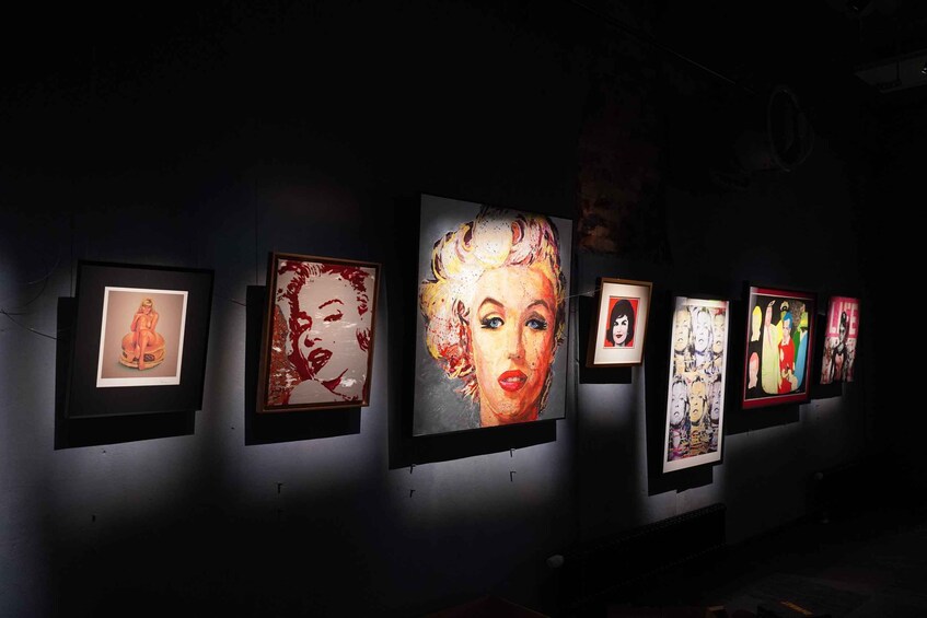 A gallery with framed artworks on display. 3