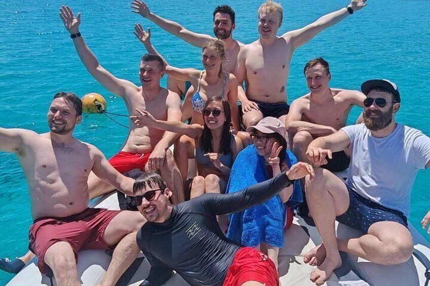 A group of people on a boat in a body of water. 1