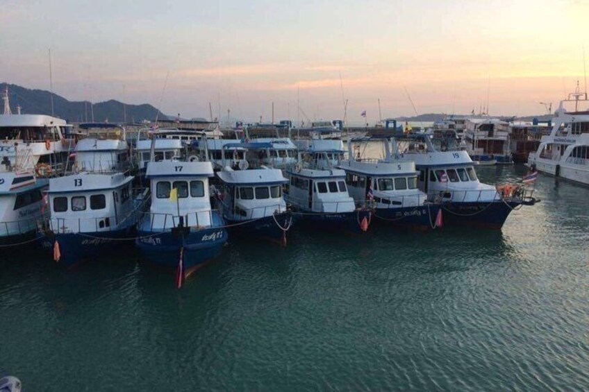A marina with several boats docked. 2