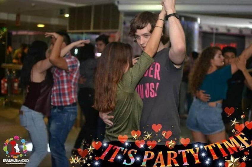A group of people dancing at a party. 3