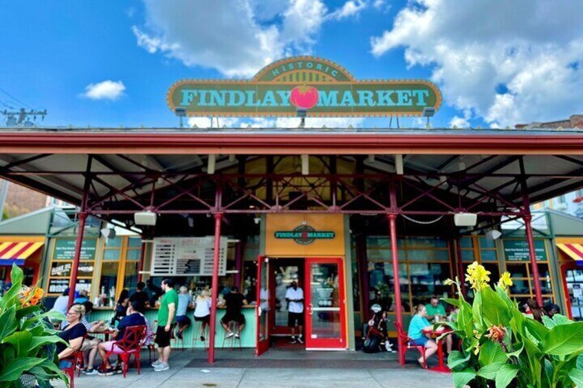 Findlay Market with a covered entrance and people sitting outside. 5