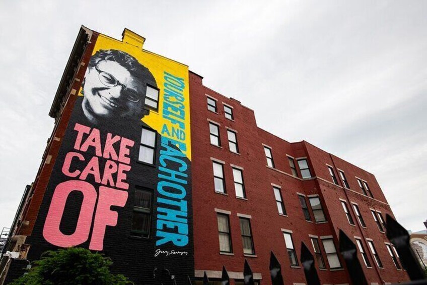 A building with a large mural on its side. 2