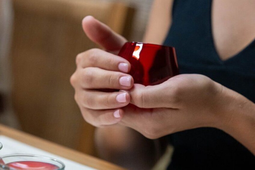 A person holding a red object. 3