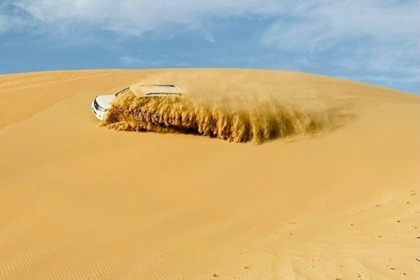Abu Dhabi Desert Safari with Sandboarding, Camel Ride & Dinner 2