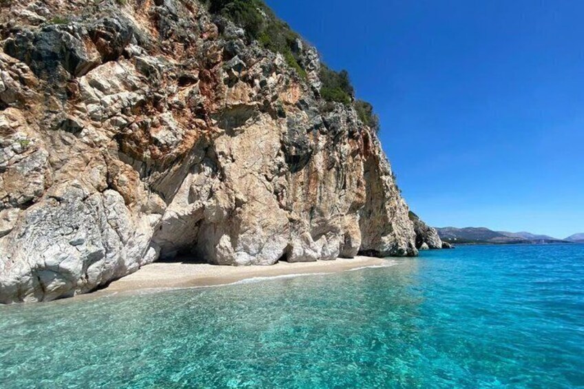 A rocky coastline with clear turquoise waters. 2