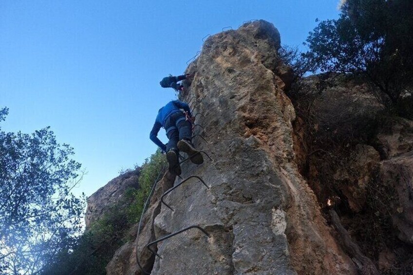 A person climbing a rocky mountain. 2