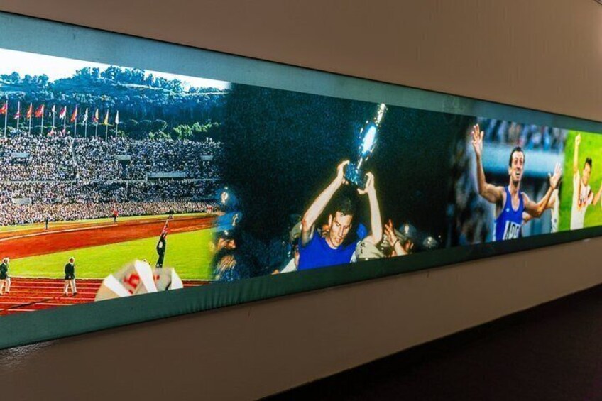 A sports stadium with spectators and athletes. 4