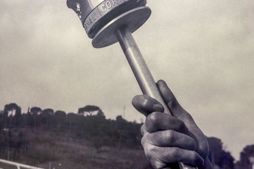 A hand holding a hammer with 'NALI CORP' engraved on it. 5