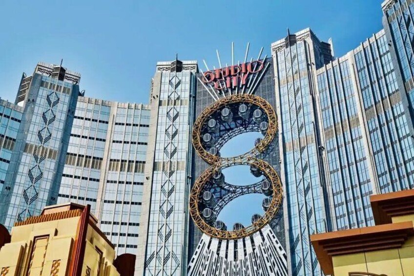 A modern building with a large circular structure and the word 'VODIUM' on top. 5