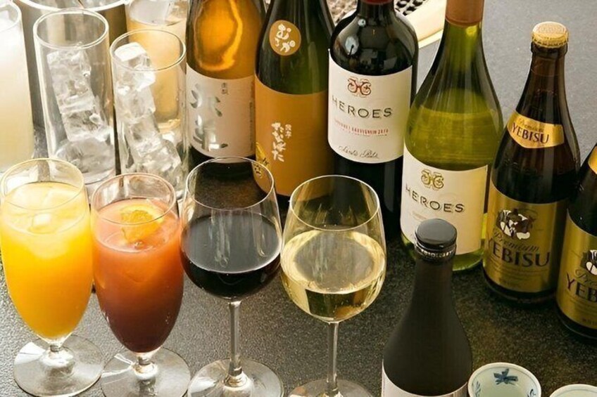 A variety of wine bottles and glasses on a table. 3