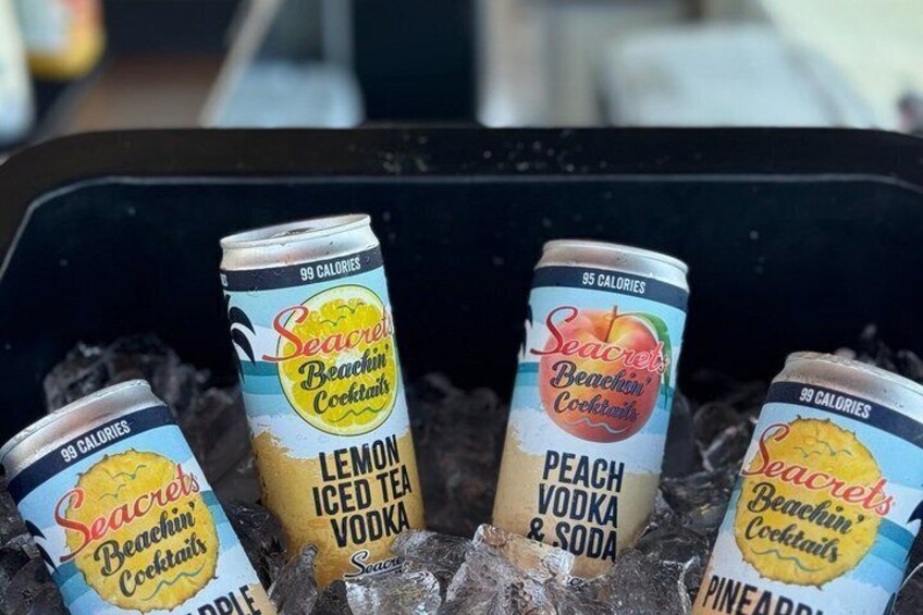 Four cans of Seacrest Beachin' Cocktails in a black container. 2