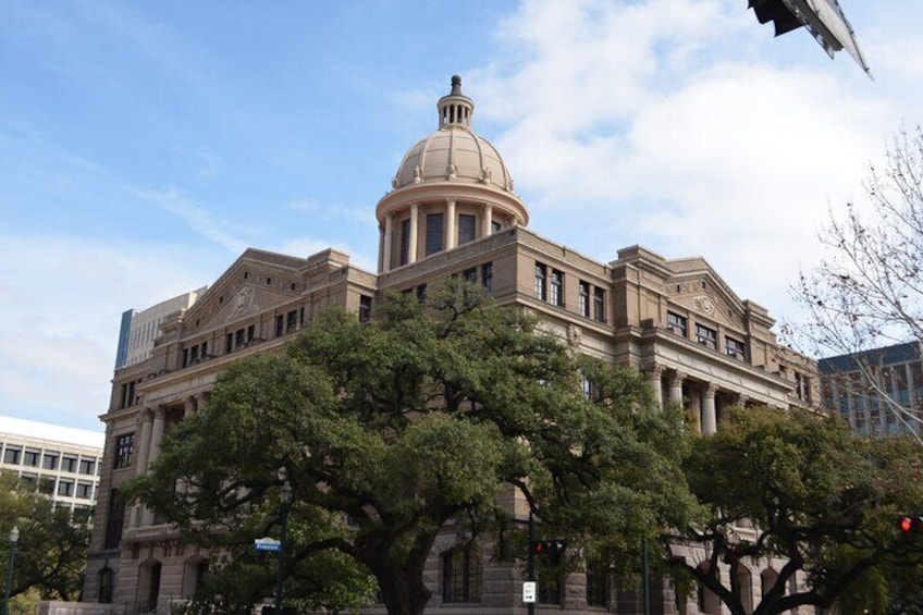 A large, historic building with a prominent dome and classical architecture. 3