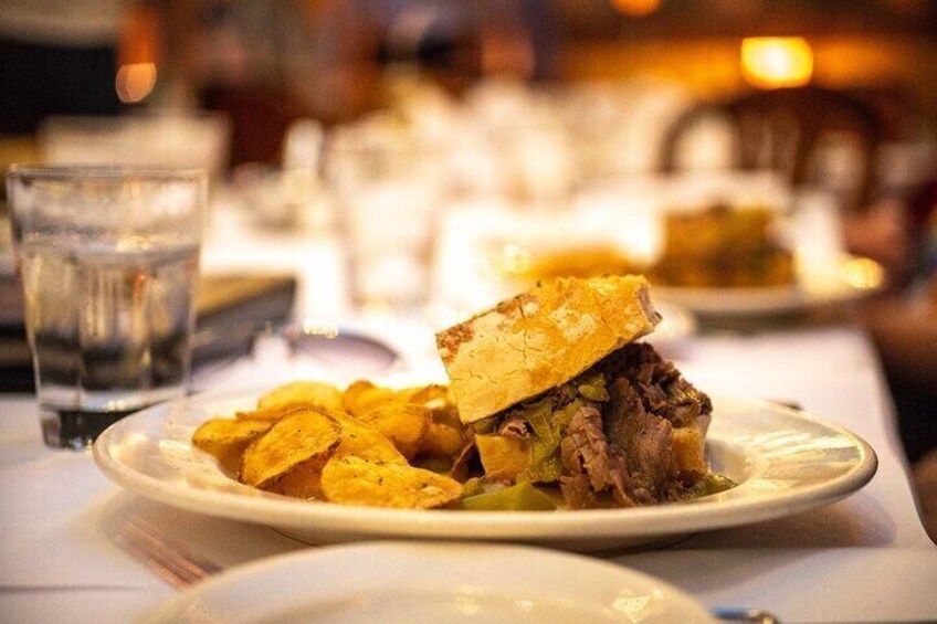 A plate with a sandwich and chips. 5