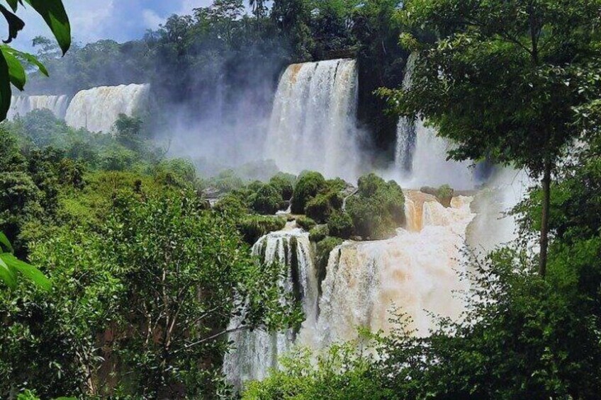 A waterfall cascading through a lush forest. 5