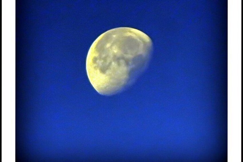 A full moon against a blue sky. 3