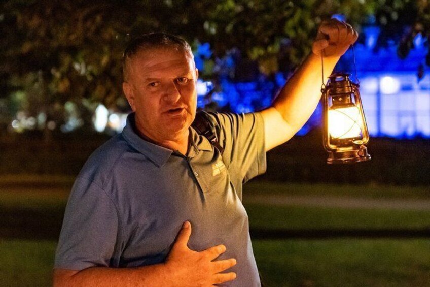 A person holding a lantern. 5