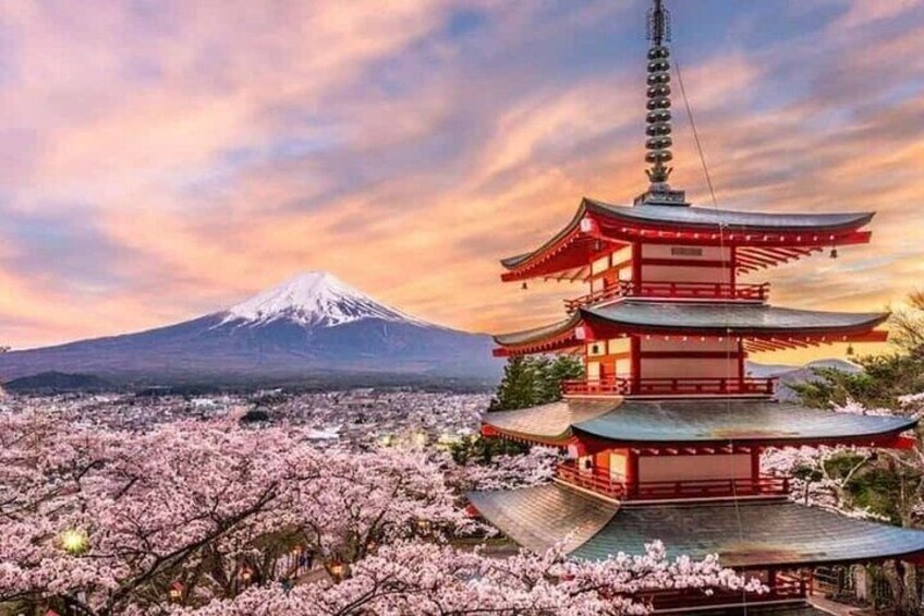 A pagoda with a snow-capped mountain in the background. 1