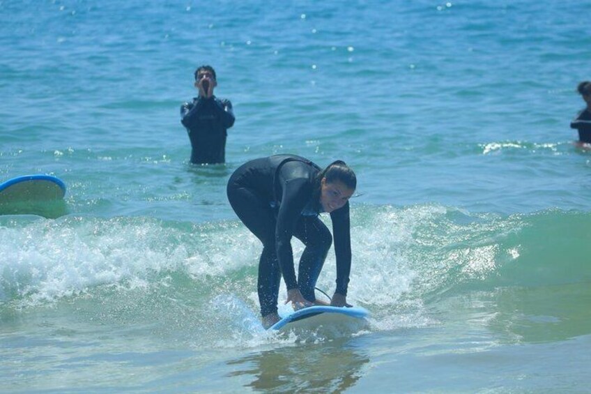 A person surfing on a wave in the ocean. 3