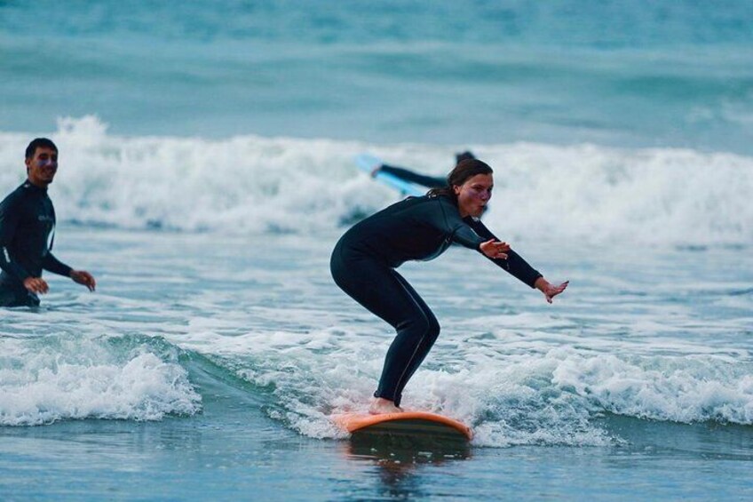 A person surfing on a wave in the ocean. 1