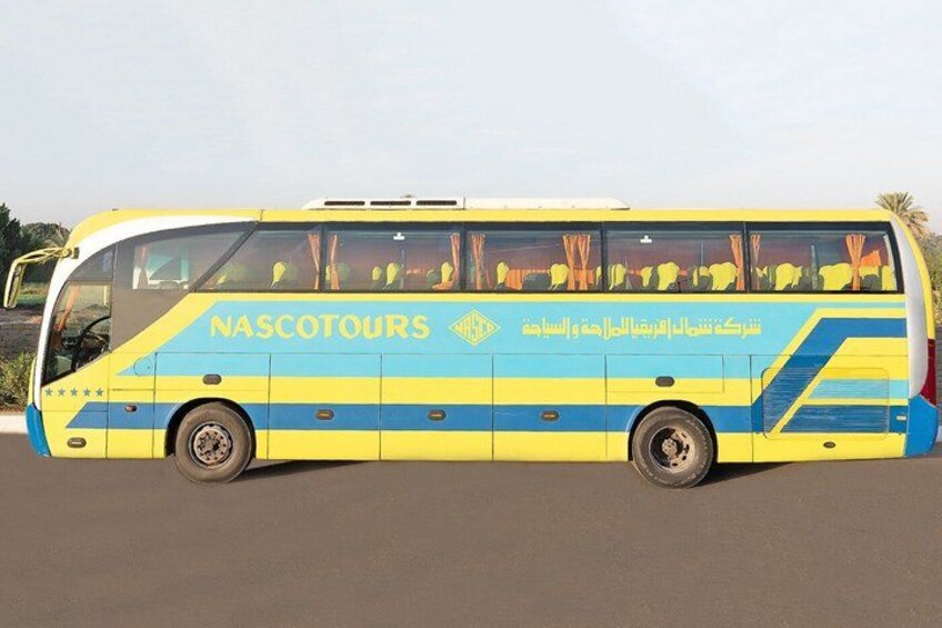A yellow and blue bus with the text 'NASCOTOURS' on its side. 2