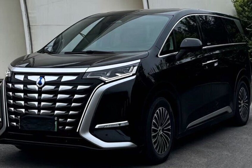 A black SUV with a distinctive grille and modern headlights. 3