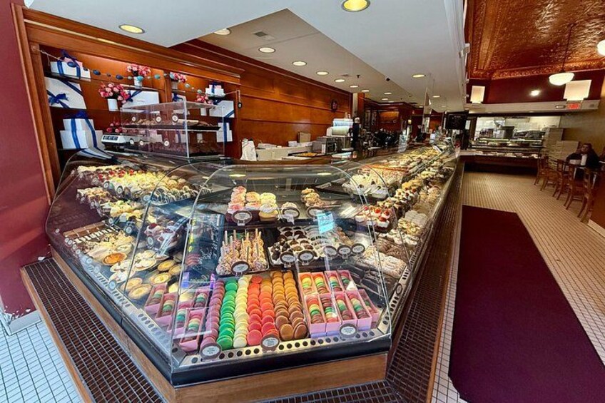 A bakery display case filled with various baked goods and pastries. 5