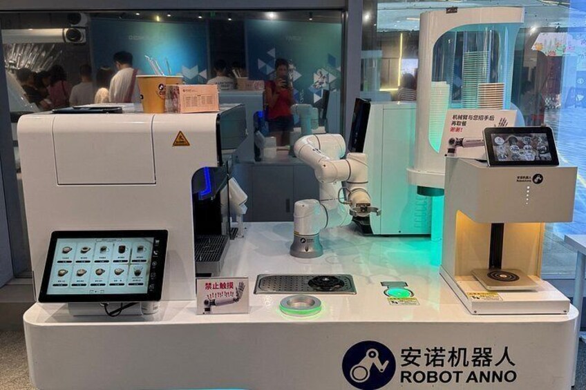 A robot-themed exhibit with a control panel, robotic arms, and a display of various mechanical parts. 5