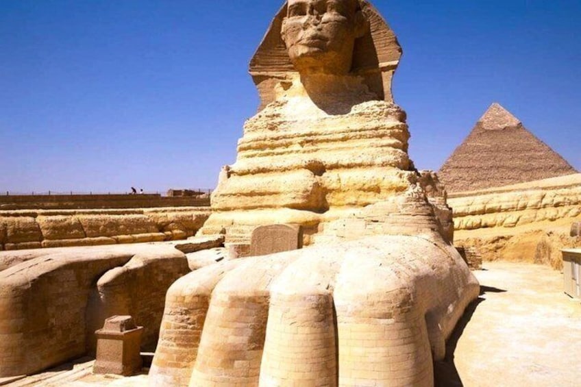 The Great Sphinx of Giza with the Great Pyramid in the background. 2