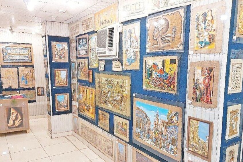 A gallery with various framed artworks on the walls. 4