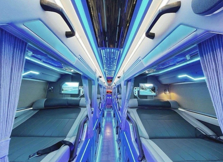 A futuristic train interior with blue lighting and modern design. 2
