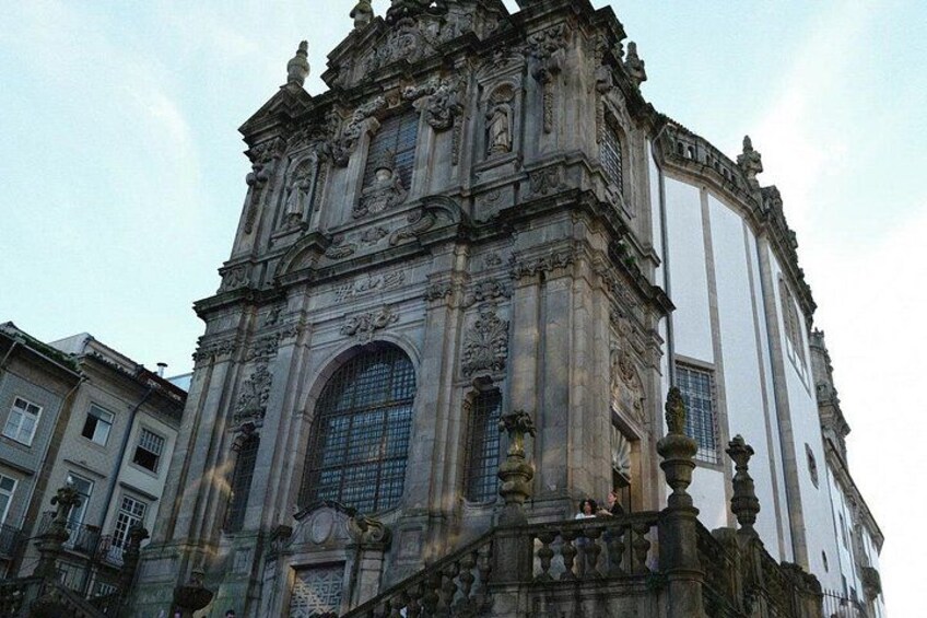 A historic building with ornate architecture, large arched windows, and detailed stonework. 2