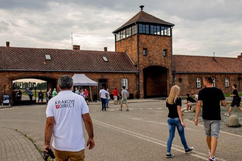 A historical building with a brick tower and an arched entrance. 5