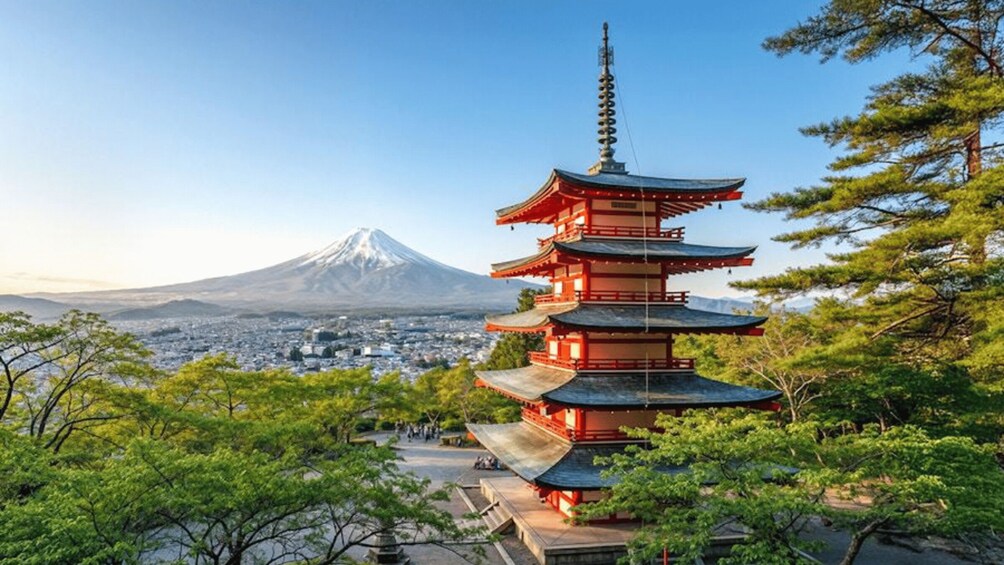 A multi-tiered pagoda with a backdrop of Mount Fuji. 1