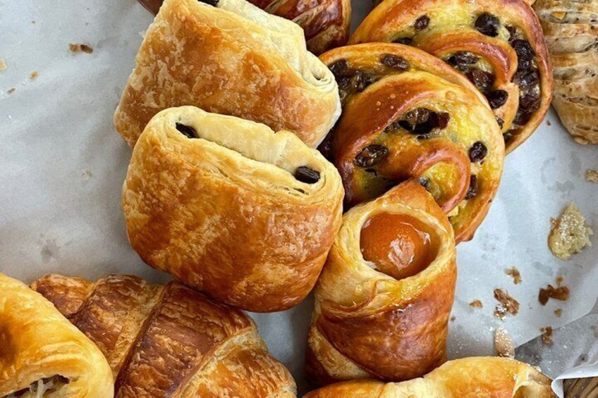 A variety of pastries, including puff pastries and filled turnovers. 4