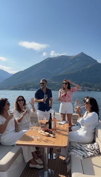 A group of people on a boat with a mountainous landscape in the background. 3
