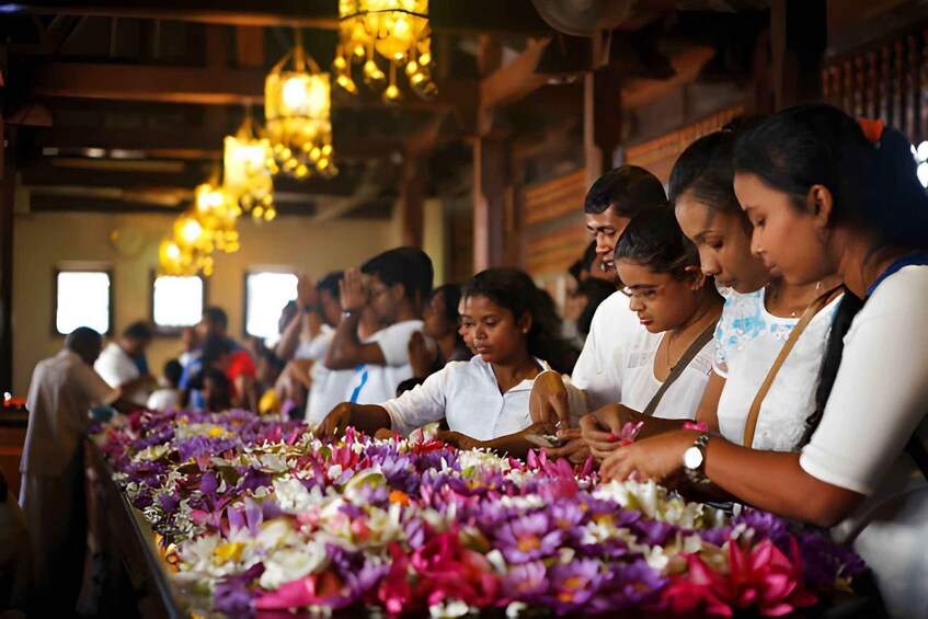 People arranging flowers in a temple. 3
