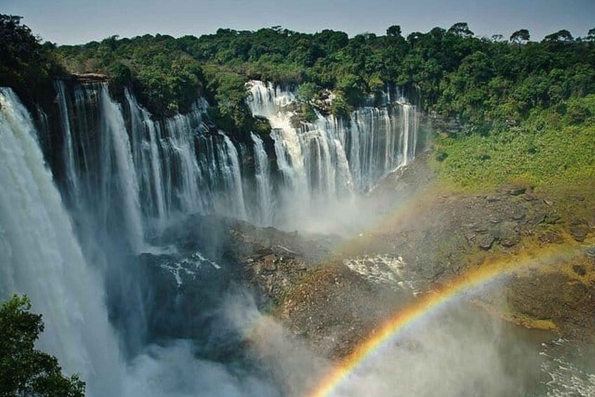 A waterfall with a rainbow. 1