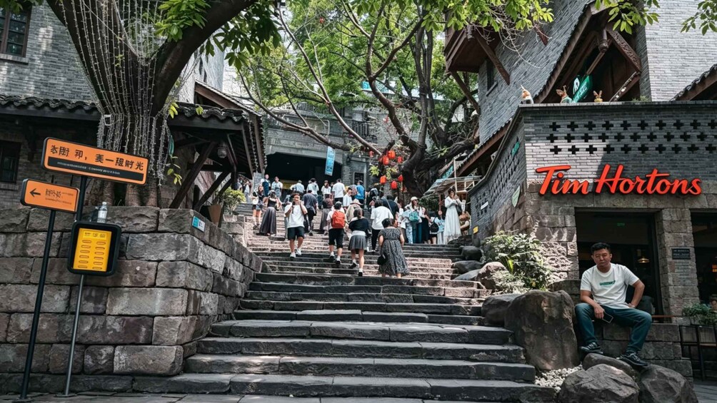 A stone staircase leading to a traditional building with a Tim Hortons sign. 2