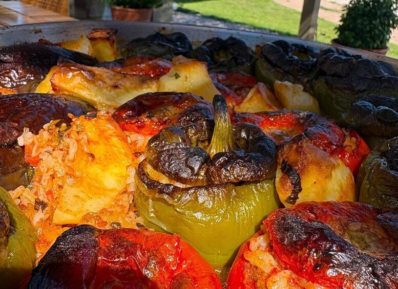 A variety of roasted vegetables including bell peppers and potatoes. 4