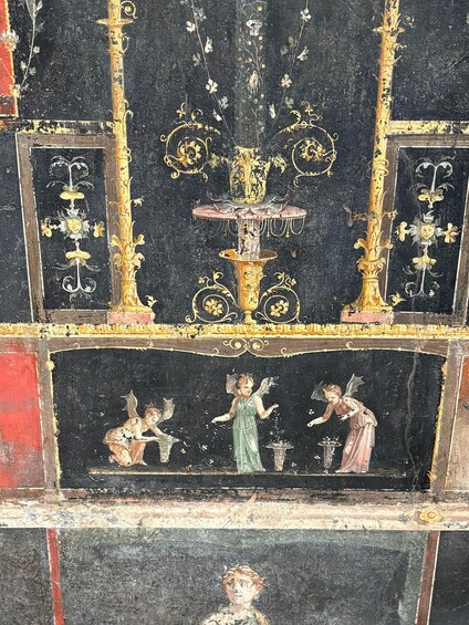 A fresco with cherubs, a central fountain, and ornate gold detailing. 3