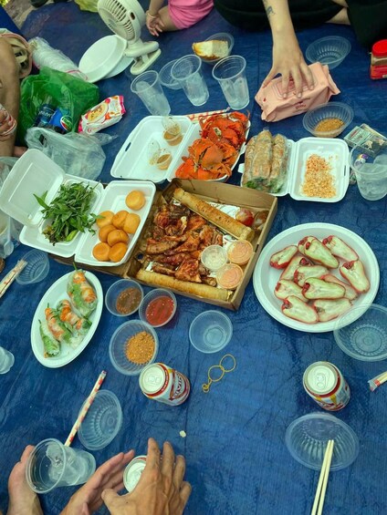A table with various food items, including seafood, vegetables, and condiments. 2