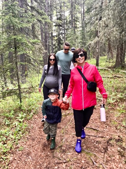 A family walking on a forest trail. 2